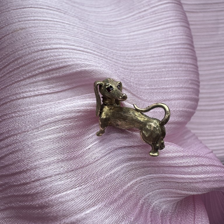 solid 9ct gold dachshund with ruby eyes